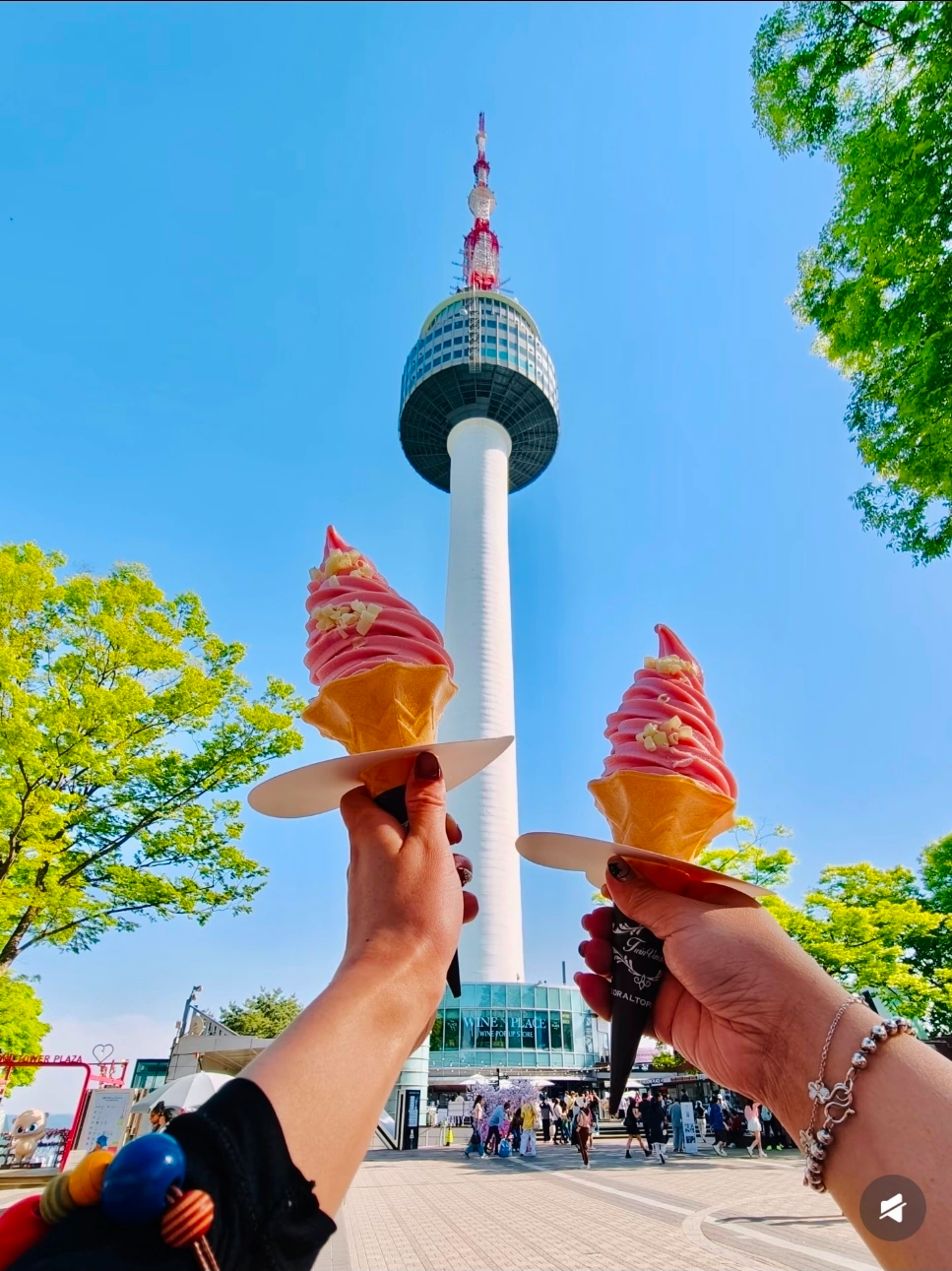 N Seoul Tower with a sweet treat in hand